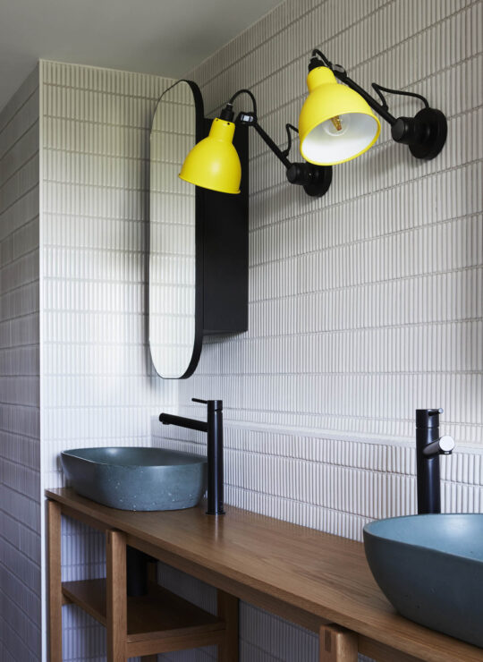 Bespoke yellow lamps and blue basins in beautiful bathroom by Denby Dowling Interior Design