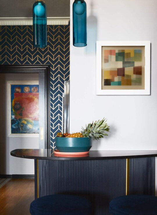 Bespoke curated interior design of entrance hallway with artwork and furniture by Denby Dowling Interior Design
